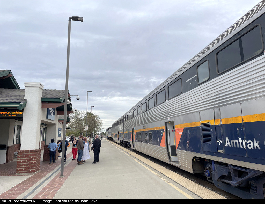 People standing on the platform at Merced Station